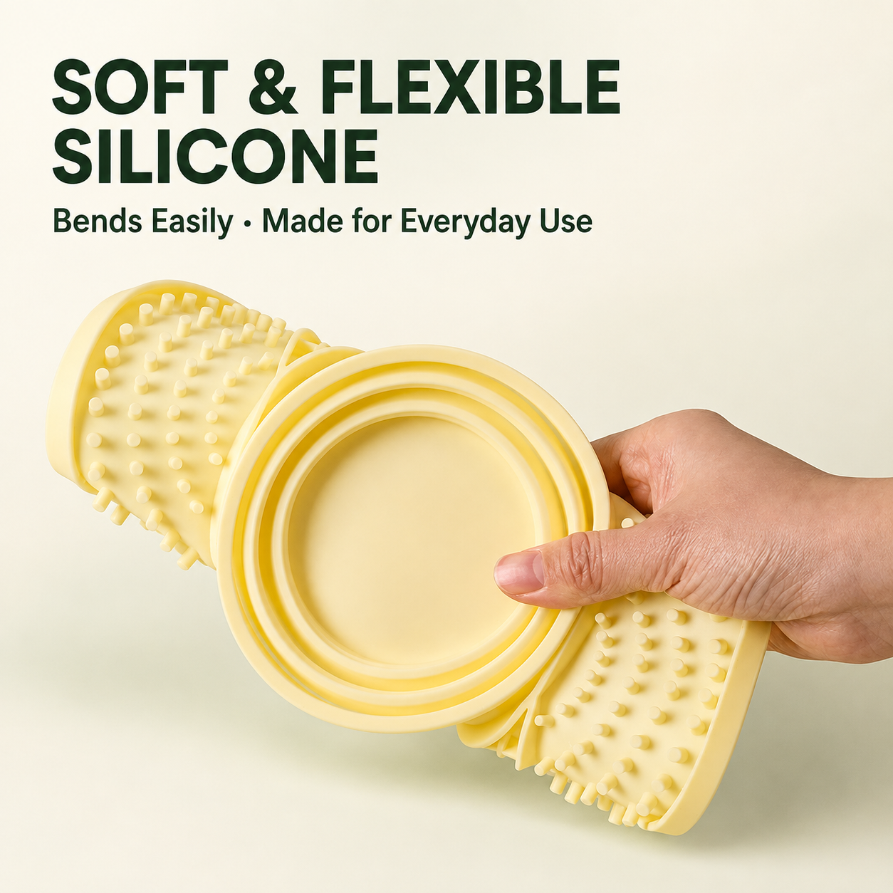 Flexible silicone slow feeder mat being folded by hand