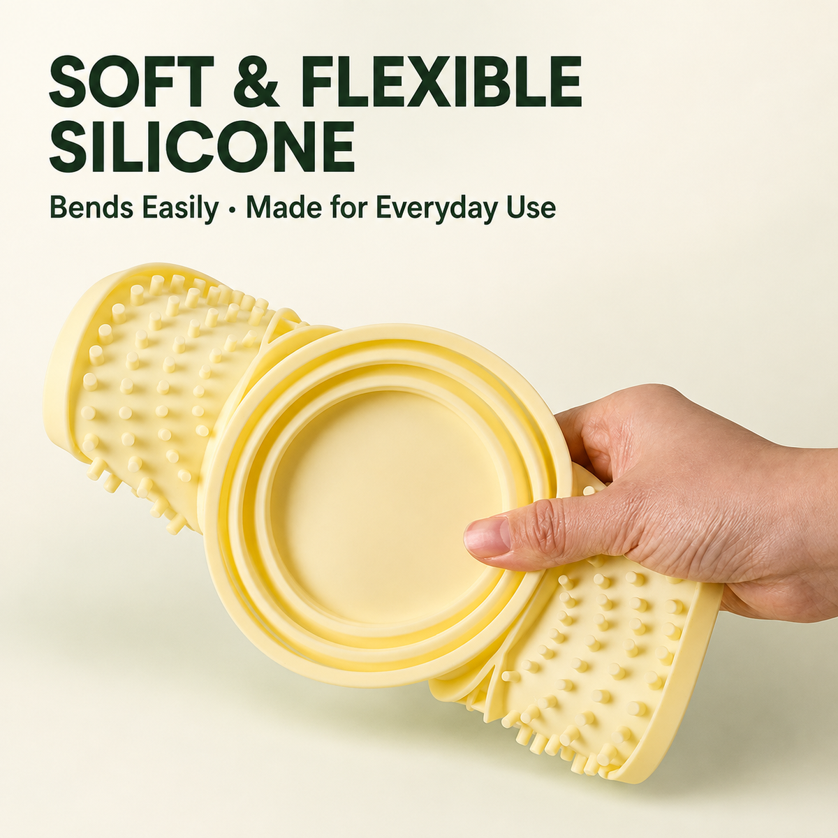 Flexible silicone slow feeder mat being folded by hand