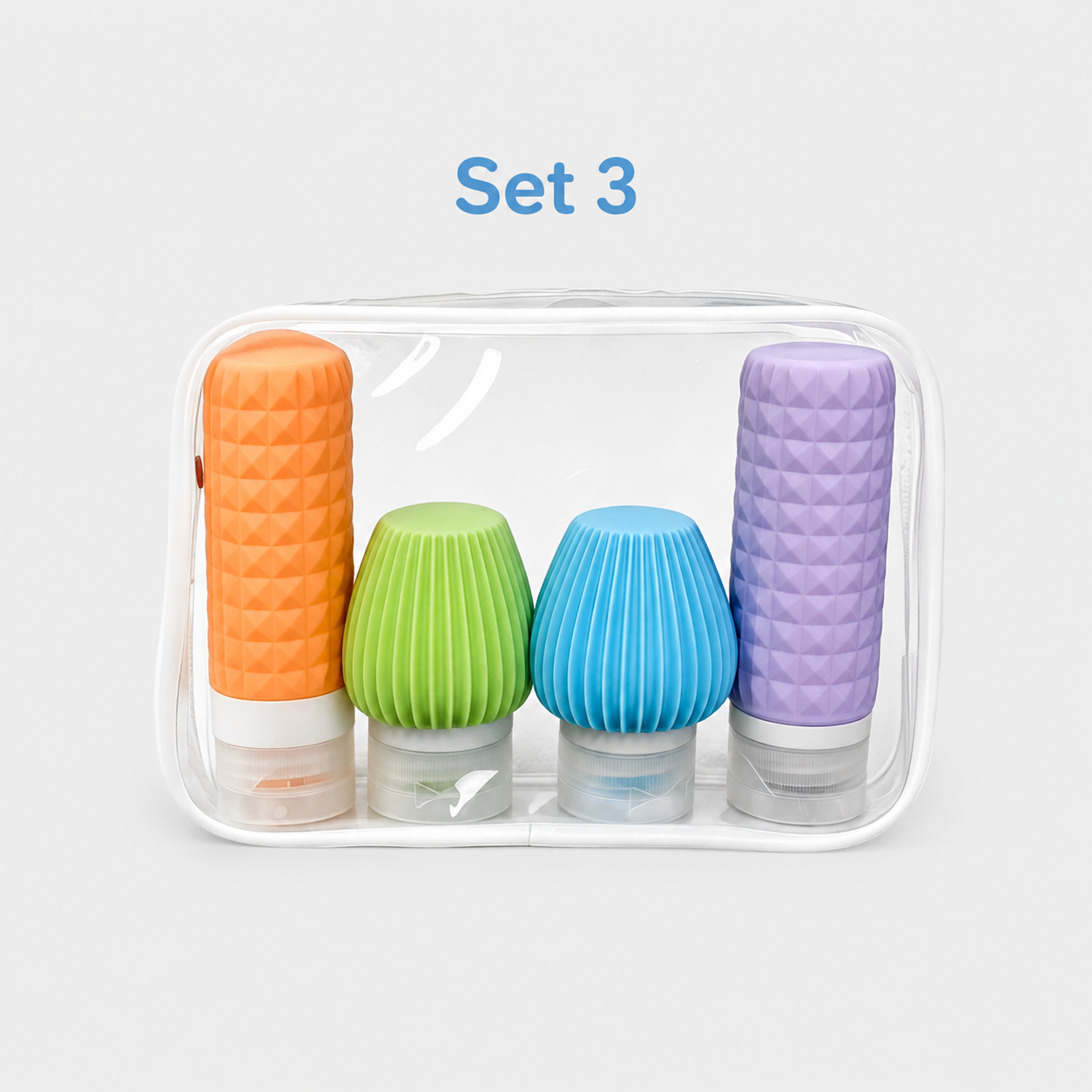 Set 3 four-piece silicone travel bottles in purple pink green and blue with clear bag