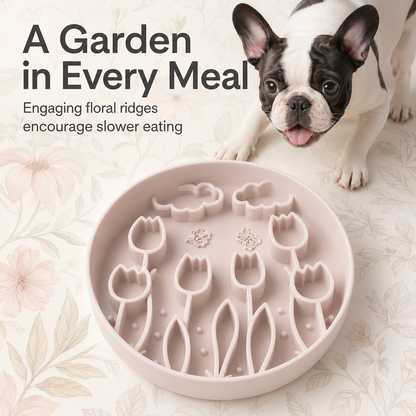 French Bulldog using a pink floral silicone slow feeder bowl with raised garden patterns