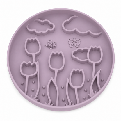 Lavender Purple silicone pet slow feeder bowl with raised tulip, butterfly, cloud, and floral garden patterns