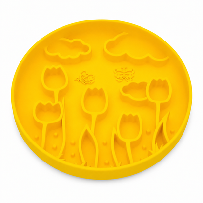 Lemon Yellow silicone pet slow feeder bowl with raised tulip, butterfly, cloud, and floral garden patterns