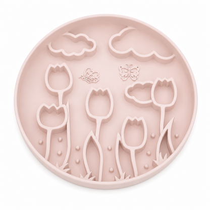 Sakura pink silicone pet slow feeder bowl with raised tulip, butterfly, cloud, and floral garden patterns