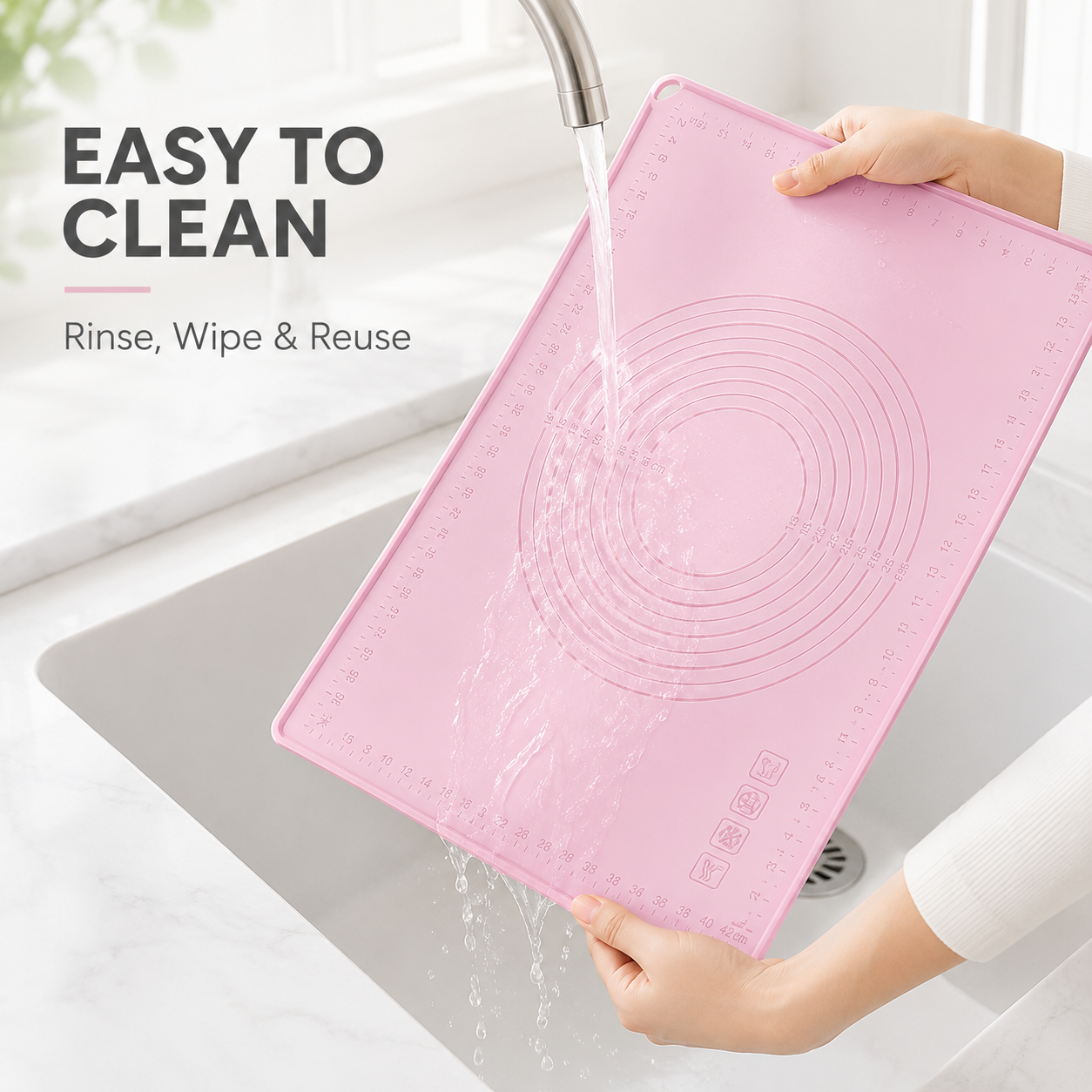 Reusable silicone pastry mat rinsed under water for easy cleaning
