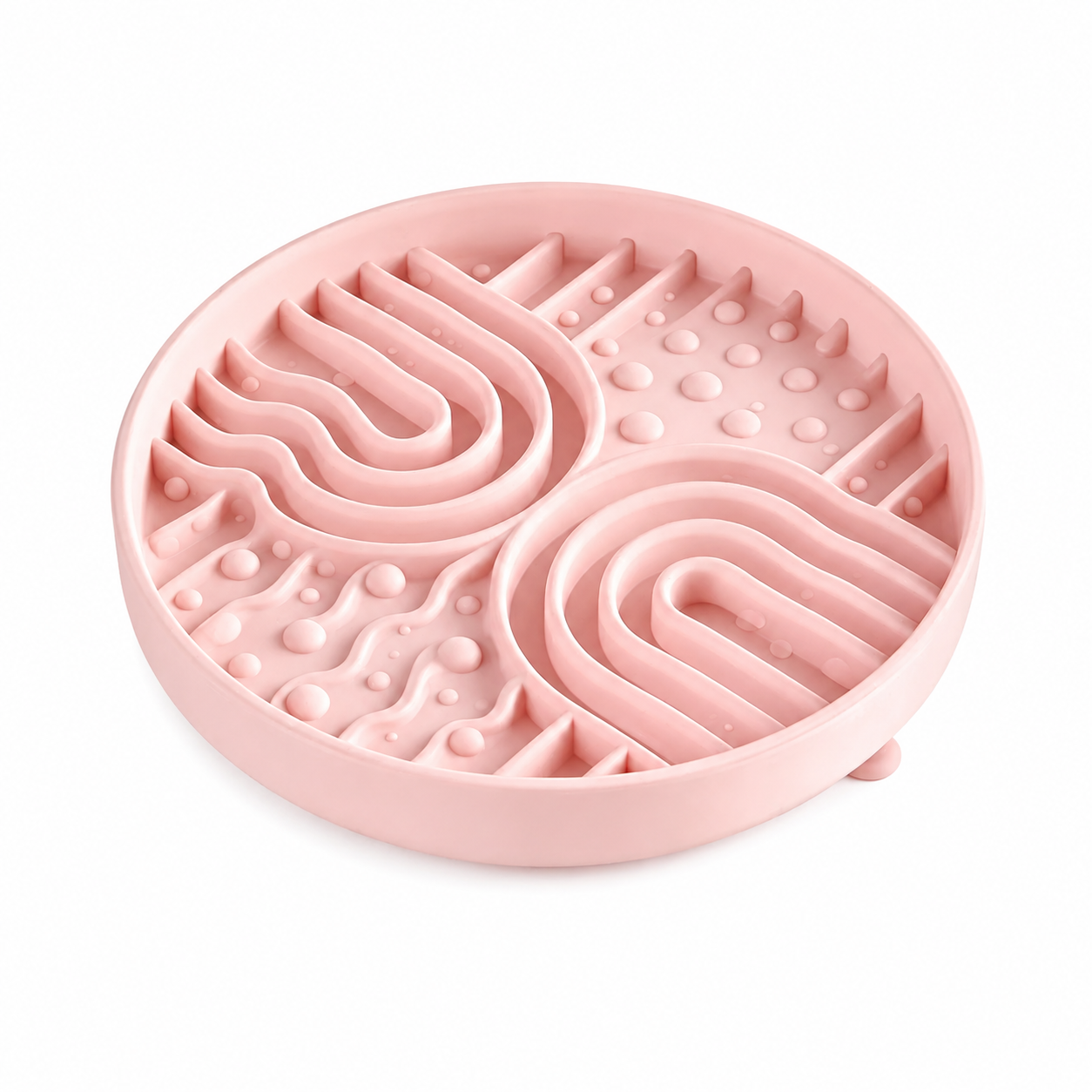 Pink silicone pet slow feeder bowl on white background, with raised maze channels and textured bumps to help pets slow down eating.