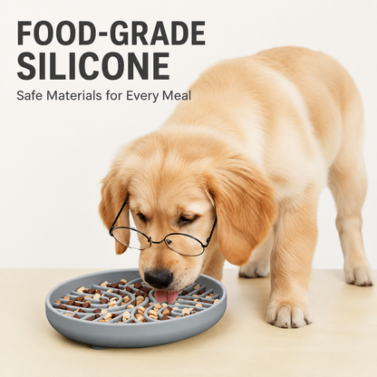 Golden retriever eating from a gray food-grade silicone slow feeder dog bowl with raised maze design
