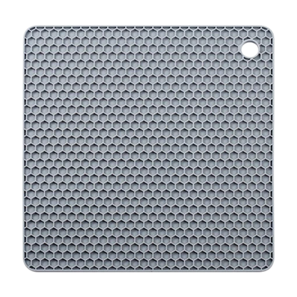Gray honeycomb silicone placemat with built-in hanging hole, designed as a heat-resistant trivet mat and table protector for kitchen use.