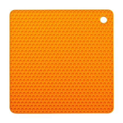 Orange honeycomb silicone placemat with built-in hanging hole, designed as a heat-resistant trivet mat and table protector for kitchen use.